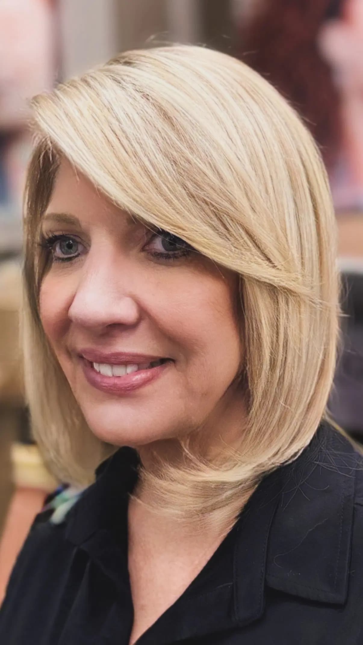 Soft golden blonde bob with a long side-swept fringe