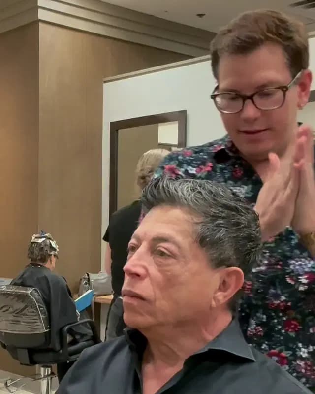 A textured silver men's cut, styled back, with Rudy Perez