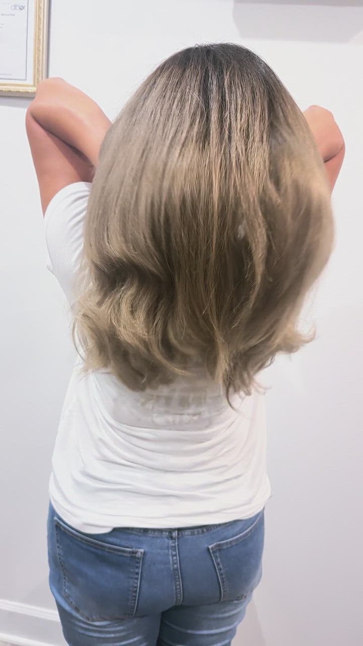 Rooted ash bronde in motion after a color correction