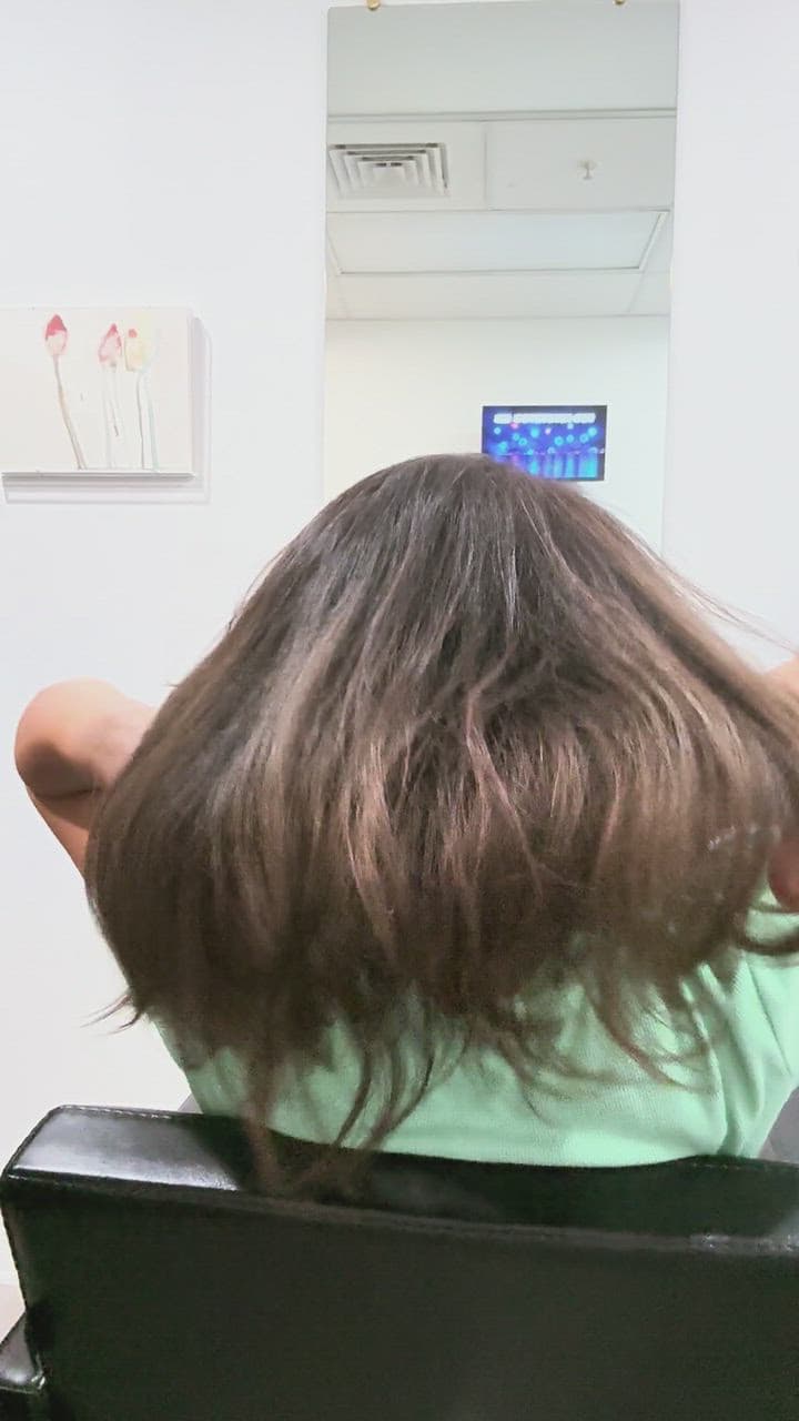 Glossy brunette layers in motion