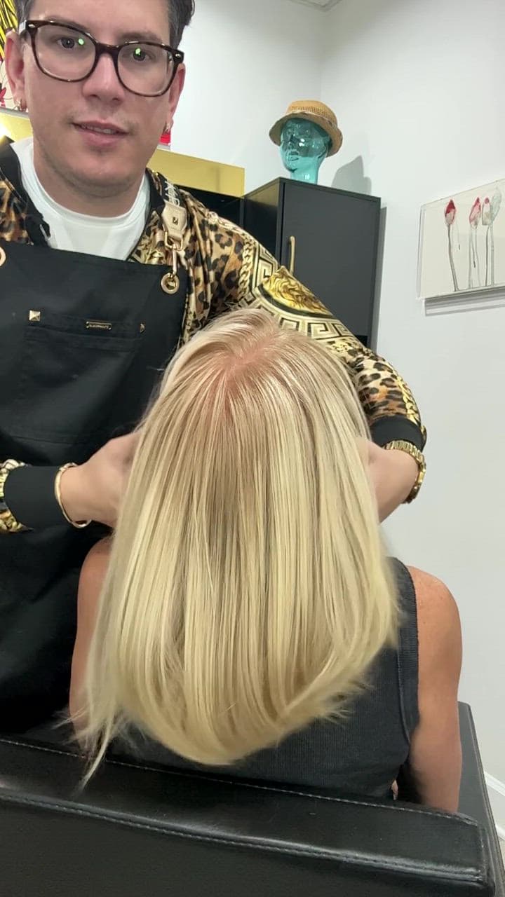 Rudy Perez Machado finishing a bright blonde lob