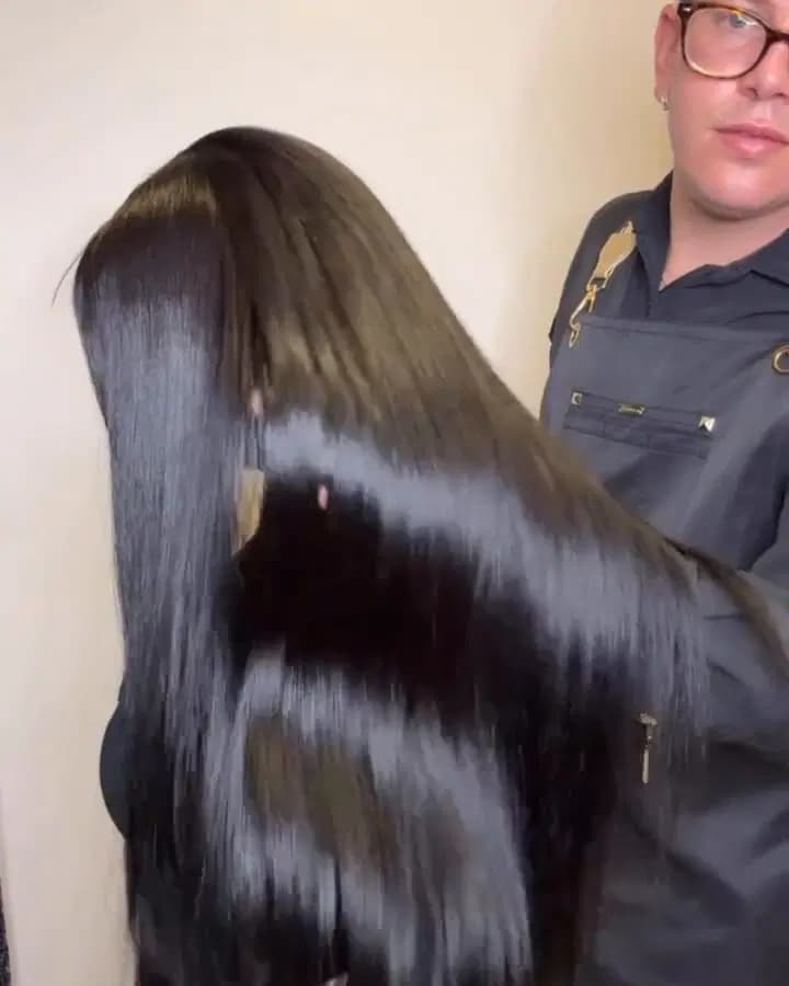 Sleek, glass-smooth straight dark hair